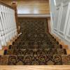 Stair runner matches up with landing rug.